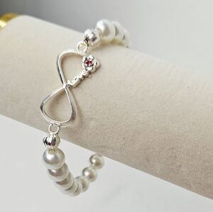 Silver Infinity Pearl Stretch Bracelet with Pink Rhinestone Flower Accent